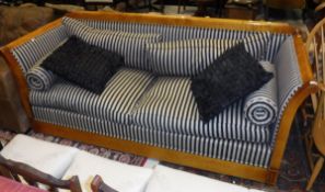 A modern walnut framed sofa with black and white striped upholstery in the Biedermeier taste