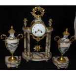 A 19th Century French alabaster cased clock garniture,