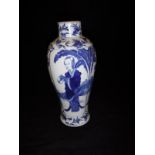 A Chinese Guangxu (1875-1908) blue and white baluster shaped vase decorated with panels of a woman