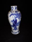 A Chinese Guangxu (1875-1908) blue and white baluster shaped vase decorated with panels of a woman