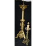 A Gothic style gilt brass pricket candlestick in the Victorian manner and an Empire style