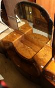 A circa 1930's walnut dressing table with single cloud shaped mirror,