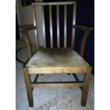 A Castle Bros oak stick back carver chair after a design by Gordon Russell,