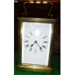 A lacquered brass cased carriage clock,