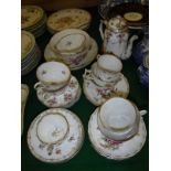 A collection of Dresden floral spray and gilt decorated tea wares