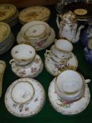 A collection of Dresden floral spray and gilt decorated tea wares