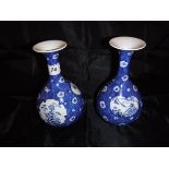 A pair of Chinese blue and white baluster shaped vases in cracked ice design with floral medallions