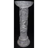 A small 19th Century lead column with plain top above a scrolling foliate and medallion decorated