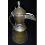 A late 18th / early 19th Century Middle Eastern brass and copper coffee pot with turned brass