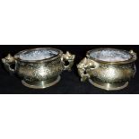 A pair of Chinese polished bronze censers with decoration of winged deer and bird and dragon and