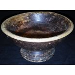 An Indian carved treen ware pedestal bowl with raffia rim