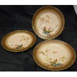 A collection of seven Limoges blossom decorated plates, a white metal seal inscribed "Mabel",