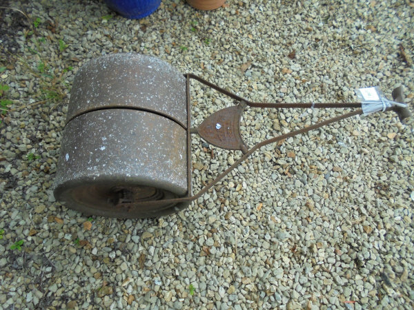 A cast iron garden roller