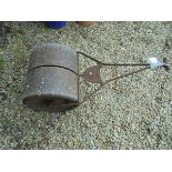 A cast iron garden roller