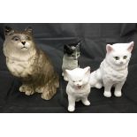 A collection of various cat figures including Beswick, Moorside,