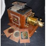 An Ensign mahogany cased and brass mounted magic lantern,