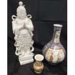 A Japanese polychrome decorated baluster shaped vase bearing six character mark to base,