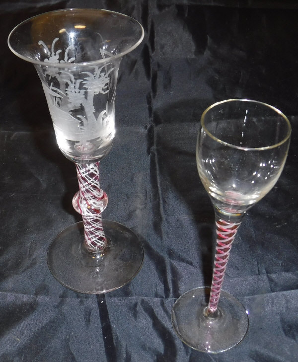 A 19th Century Dutch Masonic cut glass wine glass of inverted bell form raised on a cranberry and