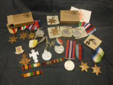 A collection of medals and medallions to include a box set of World War II medals comprising the