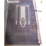 A Persian rug, the central panel set with Mirab style design with floral decorated columns,
