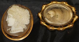 A 19th Century 9 carat gold mounted cameo brooch together with a similar yellow metal mounted