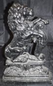 A painted cast metal doorstop of a lion rampant,