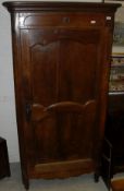A 19th Century French Provincial walnut armoire with single door,