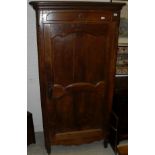 A 19th Century French Provincial walnut armoire with single door,