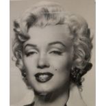 Seven assorted black and white photographic prints featuring Marilyn Monroe