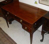 A mahogany and satinwood banded dressing table with four assorted drawers with brass ring handles,