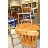 A 20th Century circular pine breakfast table on a turned pedestal,