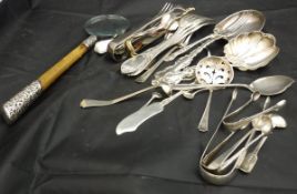 A collection of silver and plated ware to include sugar tongs, serving spoons, sifter spoons,