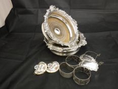 A pair of 19th Century plated wine coasters with scrolling acanthus decoration together with two