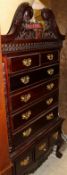 A modern mahogany chest on stand in the manner of Chippendale together with a oak corner cabinet