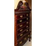 A modern mahogany chest on stand in the manner of Chippendale together with a oak corner cabinet