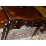 An Edwardian mahogany and inlaid dressing table with three quarter galleried top above a serpentine