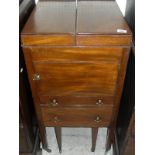 A Regency mahogany night table with doulbe rising top above a cupboard drawer and commode drawer