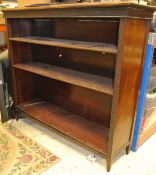 A circa 1900 mahogany open bookcase with adjustable shelving flanked by blind fretwork columns on