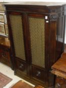 A circa 1900 mahogany wardrobe, the plain top above two grilled and glazed doors,