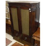 A circa 1900 mahogany wardrobe, the plain top above two grilled and glazed doors,