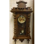 An oak cased Vienna regulator wall clock
