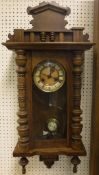 An oak cased Vienna regulator wall clock