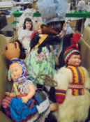 Two boxes of assorted costume dolls together with a box of assorted wall mounted hooks