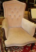 A mahogany framed arm chair in dusty pink button back upholstery