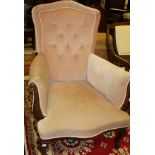A mahogany framed arm chair in dusty pink button back upholstery