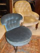 A Victorian buttoned upholstered salon chair on turned front legs to castors,