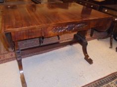A mahogany sofa table in the Regency taste