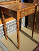 A pair of walnut side tables in the Regency manner,