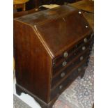 An early 19th Century mahogany and satinwood bureau,