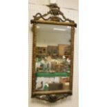 A rectangular wall mirror of gilt and gesso decorative mouldings